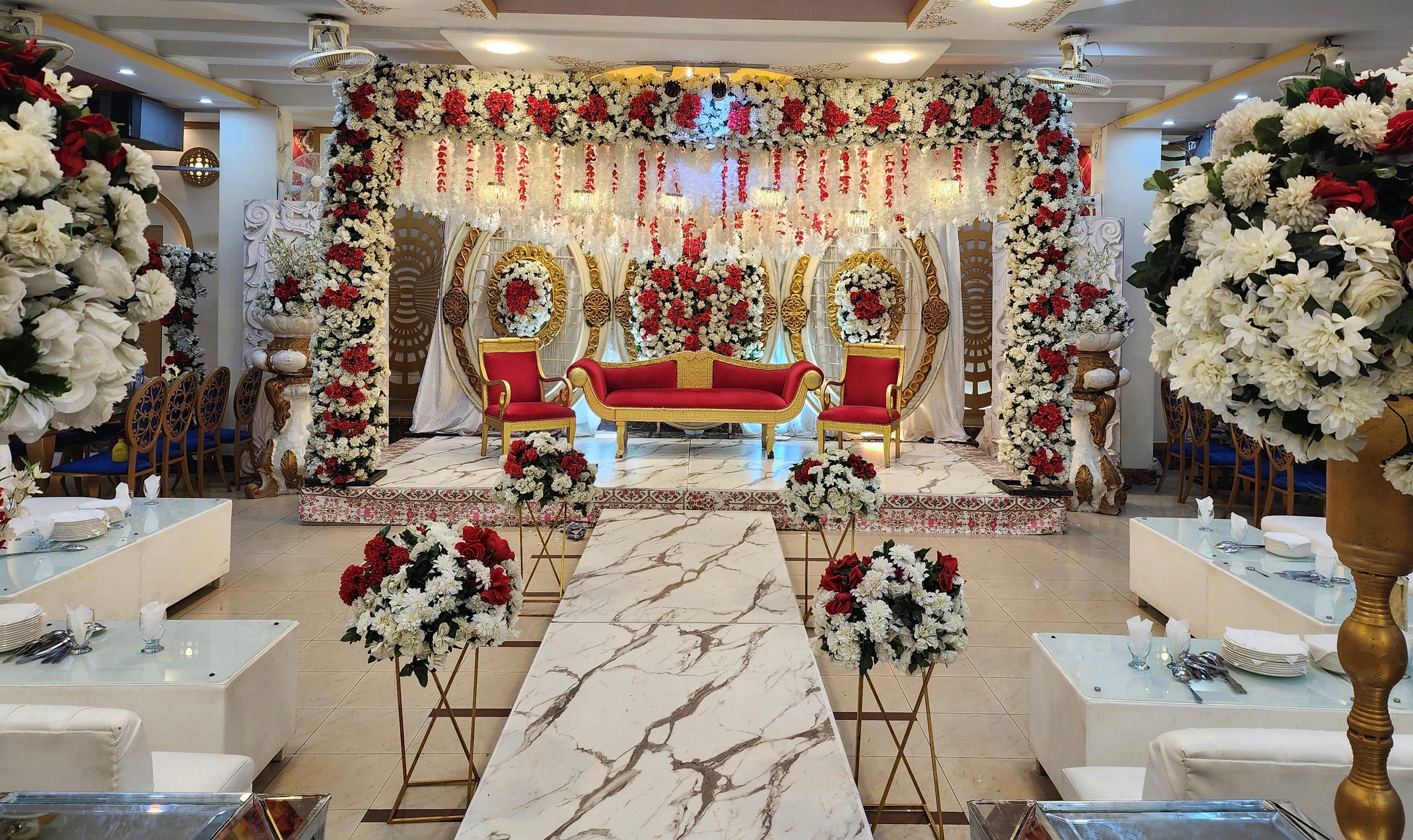 The first floor hall at Naulakha, laid out with a stage, walkway and guest tables
